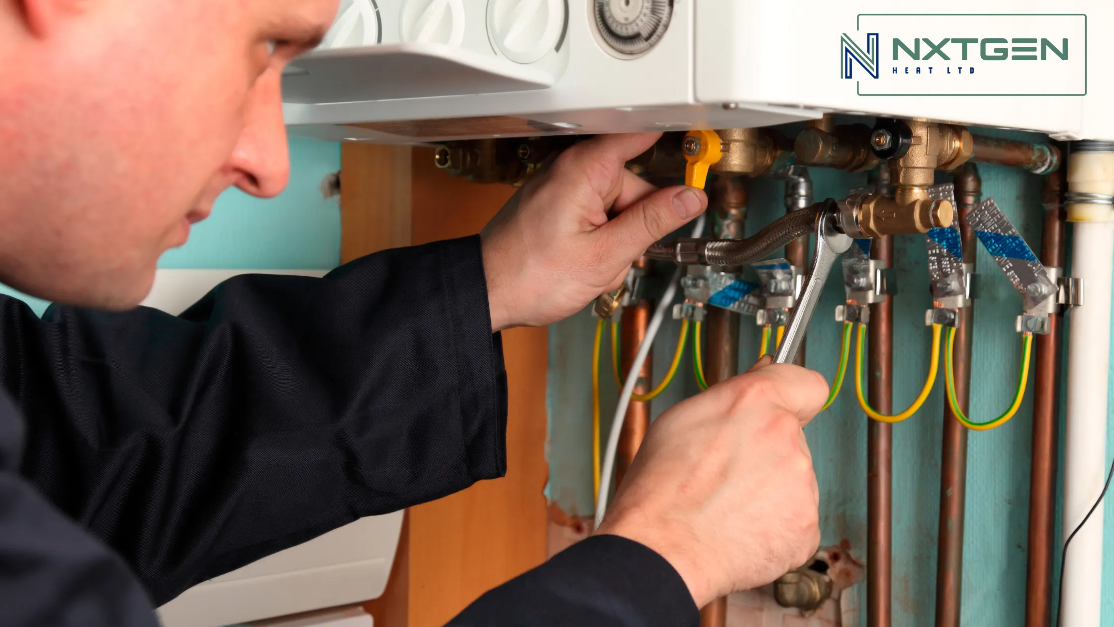 man working on boiler pipes